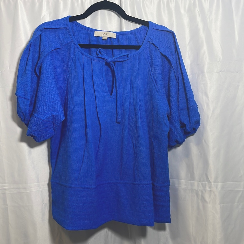 Royal blue puffy bell short sleeve loose fit tie neck top. Loft